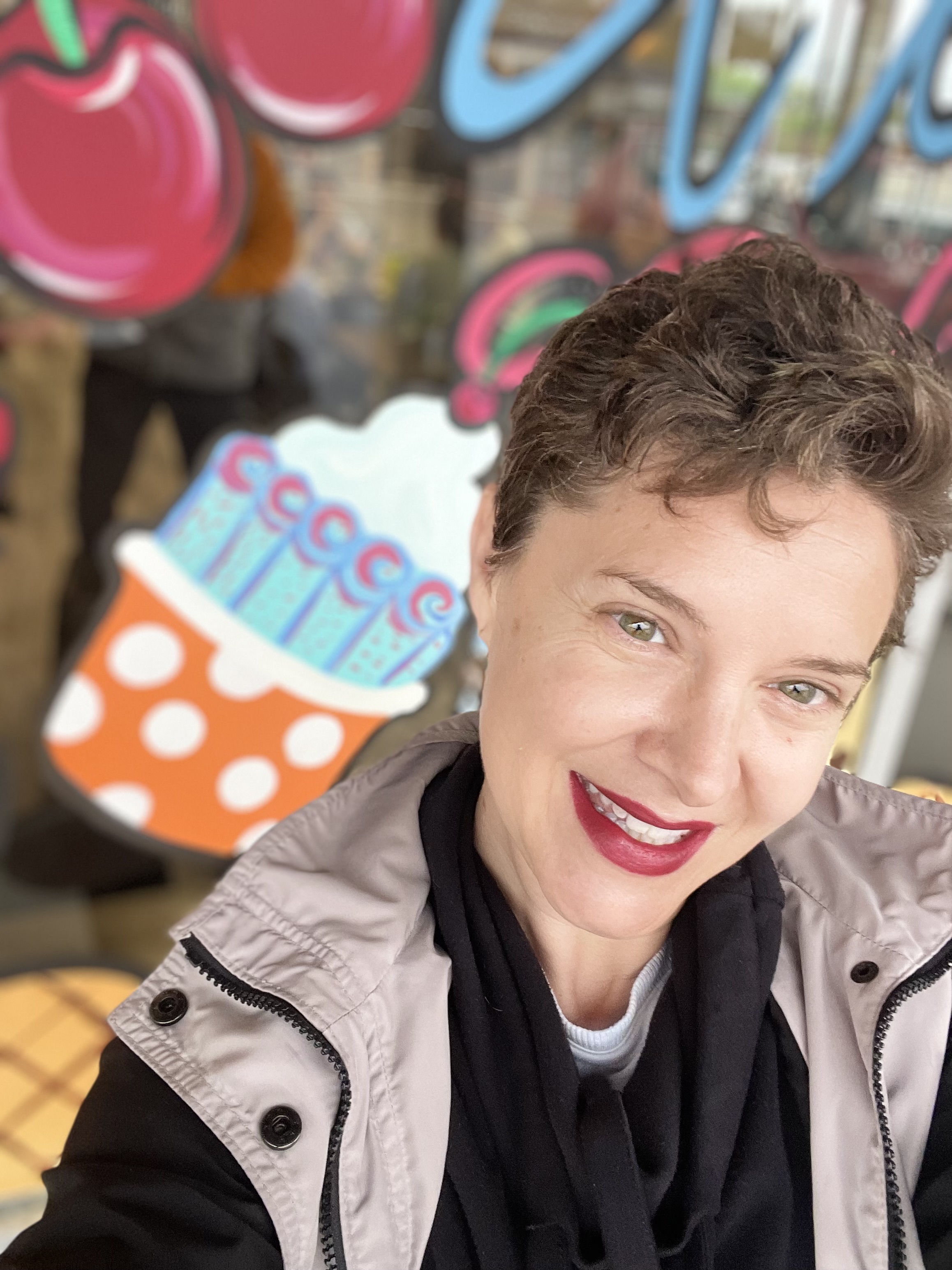 Knox painting a window with beautiful artwork